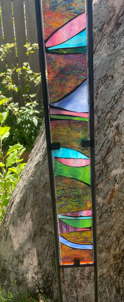 Stained glass garden stake in purple, aqua, violet