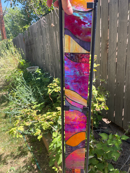 Stained glass garden stake in red, purple and orange