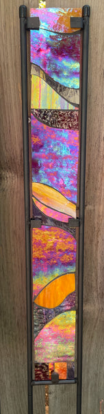 Stained glass garden stake in red, purple and orange