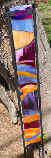 Stained glass garden stake in sunset orange, cranberry, lavender, periwinkle