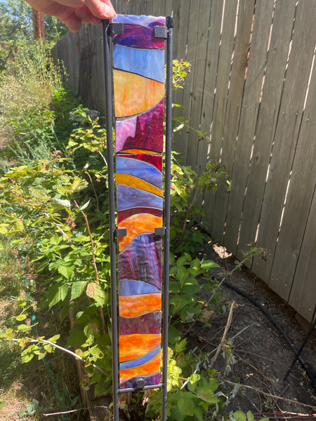 Stained glass garden stake in sunset orange, cranberry, lavender, periwinkle
